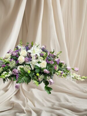 lavender-white casket spray