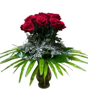 Red Roses with palm leaves in a stylish arrangement just for Valentines